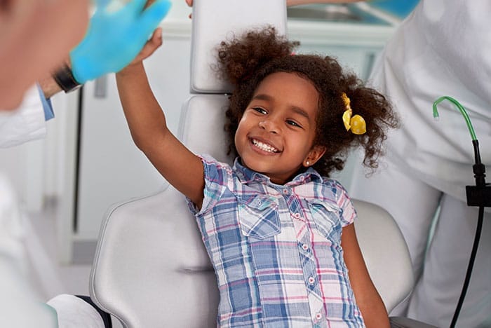 little girl having fun at the dentist